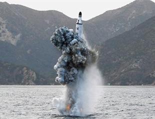 N. Koreas Kim hails successful submarine missile test