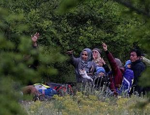 Dozens of migrants break through Macedonian border: AFP