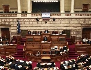 Greece passes painful fiscal reforms, heeding EU