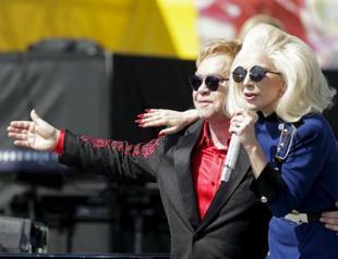 Elton John gives surprise LA concert with Lady Gaga as guest