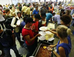 Germany puts refugees to work... for one euro