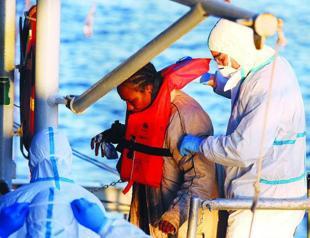 Italy rescues 2,400 boat migrants, finds three corpses