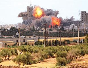 Suspected US coalition strikes kill 56 civilians in ISIL-held Syrian city near Turkey border