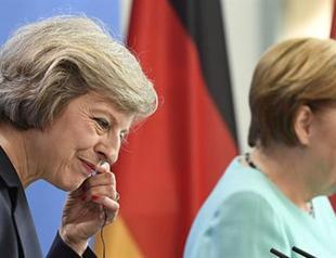 Merkel accepts Britains decision to delay triggering Brexit