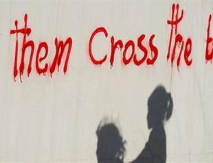 Tired of Greece, migrants try to swim back to Turkey