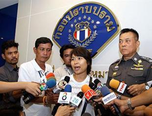 Thai police briefly detain British journalist’s wife over royal photos