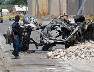 Suicide bombers hit peacekeeping base in Somali capital, 13 dead