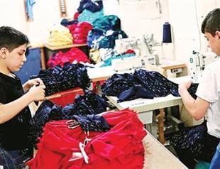 In Turkish sweatshops, Syrian children sew to survive