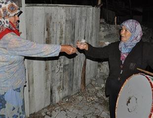 Female drummer bangs it loud to wake all for Ramadan meal