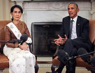 Obama vows to lift Myanmar sanctions as Suu Kyi visits