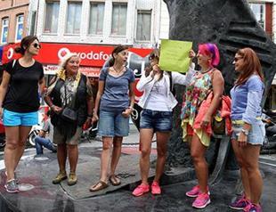 Turks protest assault of woman who wore shorts