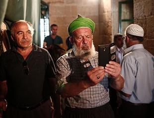 Turks cross to Greek Cyprus for Eid prayers at historic mosque
