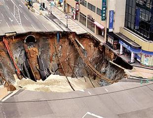 Giant sinkhole swallows Japan city street