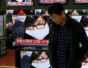 South Korea issues arrest warrants for two ex-presidential aides