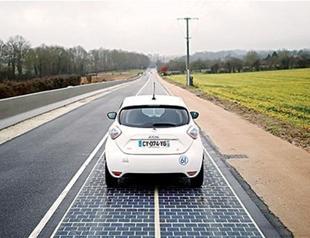 In first, road paved with solar panels powers French town