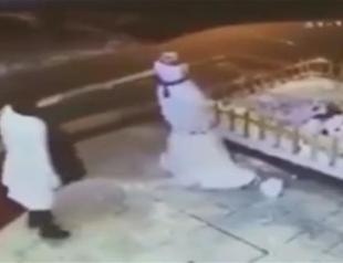Footage showing Ankara woman slipping and falling while kicking snowman goes viral