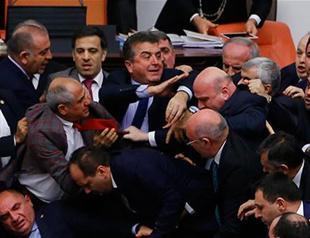 Parliament approves three more articles amid heated brawl