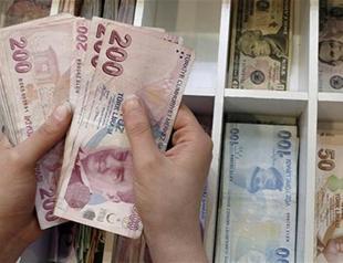 Turkish Lira tumbles to new record low against dollar