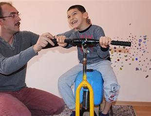 Struggling father builds wooden physiotherapy tool for son in central Turkey