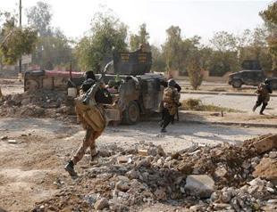 Iraqi forces link up in north Mosul, make gains in southeast