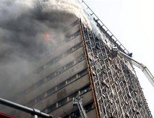 Many Iran firefighters feared trapped in building collapse