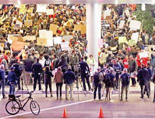 US enforces travel ban amid protests