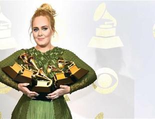 Adele sweeps Grammy awards in upset victory over Beyonce