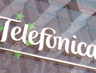 Debt-laden telecoms firm reports profit fall