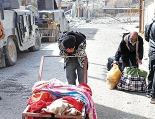 Iraqi civilians flee fighting, privation in western Mosul