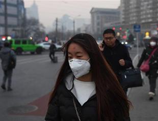 Under smog alert, Beijing orders factories to shut or cut output