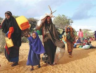 Cloaked in rags and dust, Somalis flee looming famine