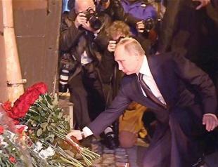 Russia raises death toll in metro bombing to 14