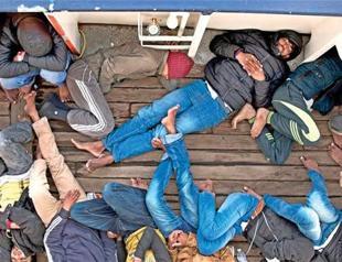At least 97 migrants missing as boat sinks off Libya