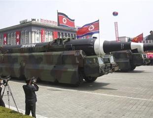 North Korea flaunts long-range missiles in massive parade