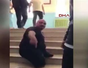 Physically impaired Turkish man climbs stairs on hand to vote