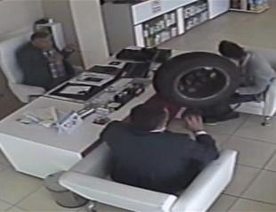 VIDEO: Tire plunges into pharmacy, injures two people in Turkeys Adana