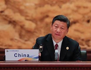 China’s Xi decries protectionism, touts Silk Road