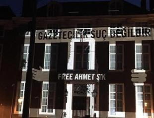 Amnesty International projects names of jailed journalists onto Turkish embassy in The Hague