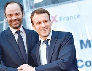 France’s Macron appoints center-right PM to widen appeal