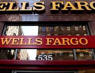 Pay slashed for eight top Wells Fargo execs after scandal