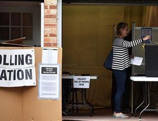 In shadow of terror, Britons vote in key election