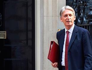 UK’s finance minister says challenge to avoid ‘cliff-edge’ Brexit