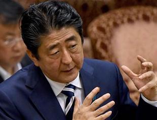 Japan PM Abe’s support slumps amid doubts about school scan