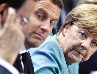 Merkel takes aim at Trump ahead of stormy G-20