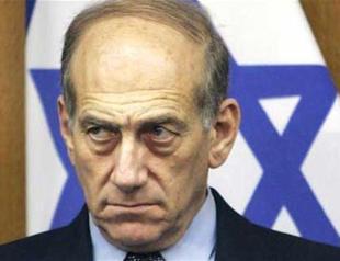 Former Israeli PM Olmert, 71, wins early release from prison