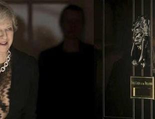 Weakened British PM reaches out to rivals