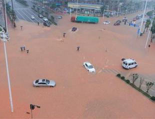 Heavy rain in Southern China causes floods, killing 56