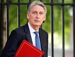 UK vows not cut taxes below European average after Brexit