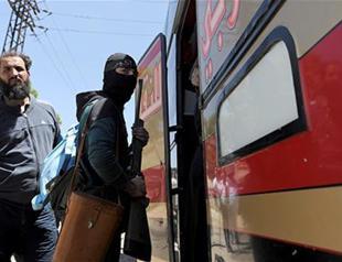 Rebels leave last opposition district in Syria’s Homs