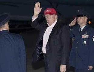 Trump back on offensive after brief respite in Paris